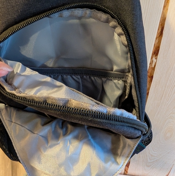 Waterfly Crossbody Sling Backpack with Durable Fabric and Single Strap Design - Picture 5 of 7